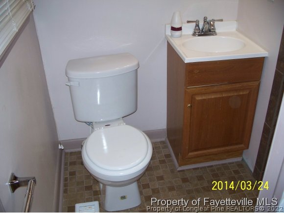 3636 Drayton Road Fayetteville, NC 28303 - Photo 16 of 25 a bathroom with a toilet and a sink