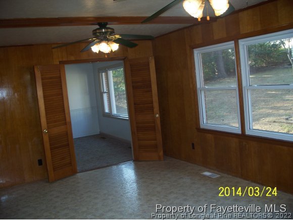 3636 Drayton Road Fayetteville, NC 28303 - Photo 22 of 25 wooden floor in an empty room with a mirror