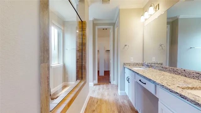 an empty room with a window and a ceiling fan