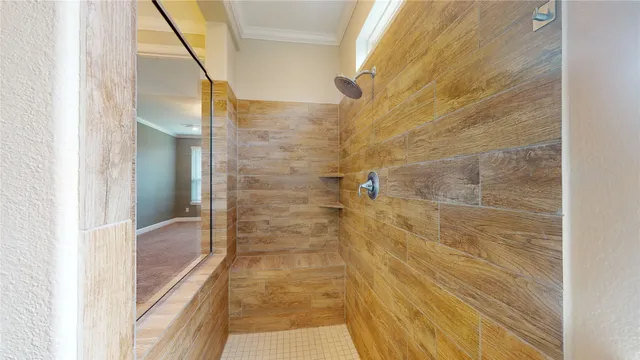 an empty room with closet and a chandelier fan