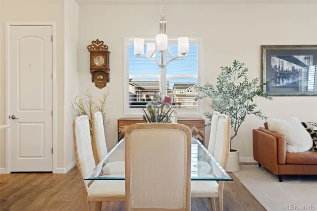 a view of living room with furniture and a chandelier