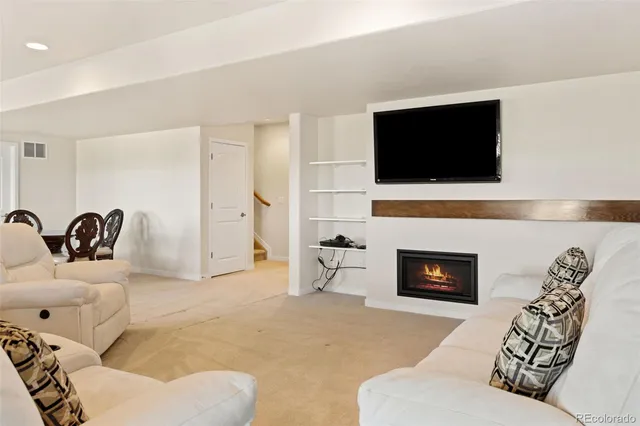 a living room with furniture and a couch