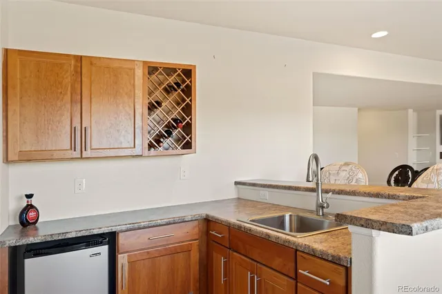 a livingroom with a flat screen tv and a window
