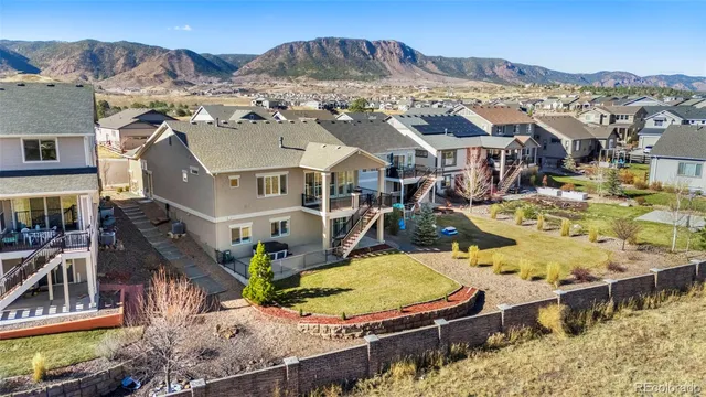 an aerial view of a house with swimming pool