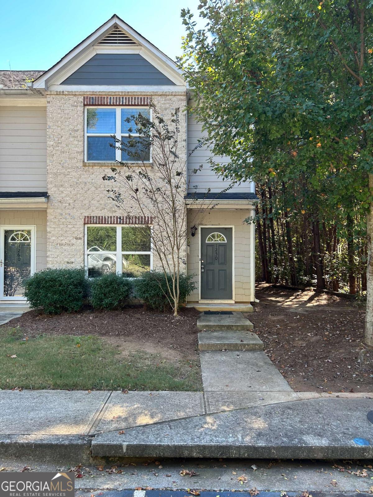 1470 Binghampton Circle Bogart, GA 30622 - Photo 1 of 1 a front view of a house with a yard