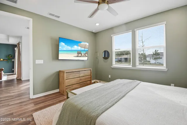a bathroom with a granite countertop sink a toilet and a mirror