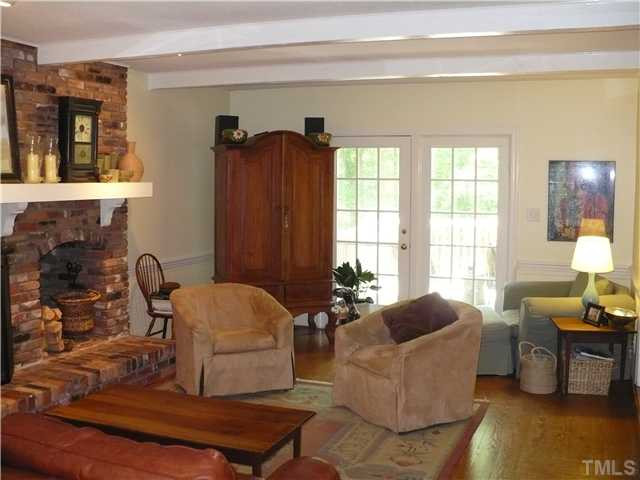 8633 Langtree Lane Raleigh, NC 27613 - Photo 3 of 12 a living room with furniture and a window