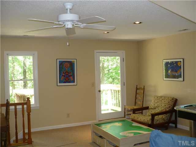 8633 Langtree Lane Raleigh, NC 27613 - Photo 8 of 12 a room with furniture and a window