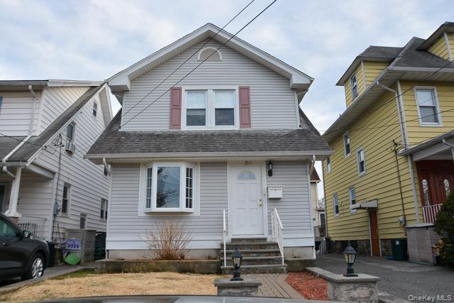 a front view of a house with a garage
