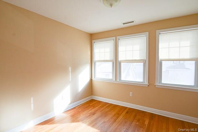 26 St Pauls Place New Rochelle, NY 10801 - Photo 11 of 16 an empty room with a window