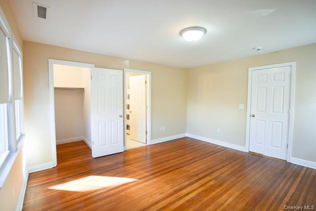 26 St Pauls Place New Rochelle, NY 10801 - Photo 14 of 16 a view of empty room with wooden floor