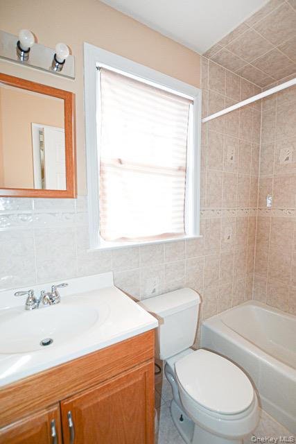 26 St Pauls Place New Rochelle, NY 10801 - Photo 8 of 16 a bathroom with a sink a toilet and shower