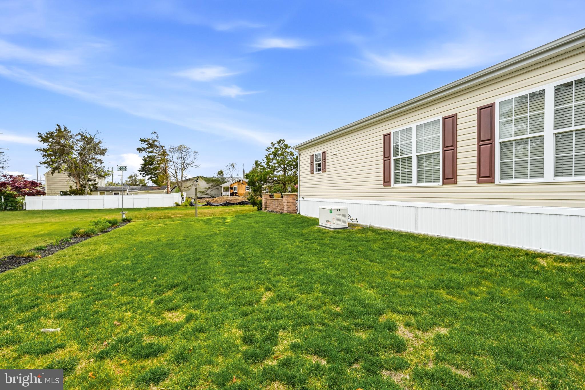 430 Rt Us 9 Street South, Unit 137 Marmora, NJ 08223 - Photo 17 of 24 a view of a house with a backyard