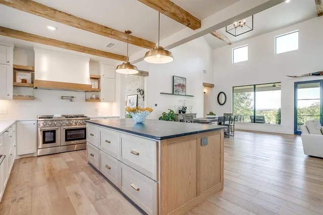 a living room with furniture and a floor to ceiling window