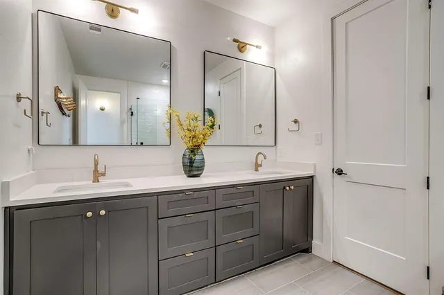 a kitchen with a refrigerator and a sink
