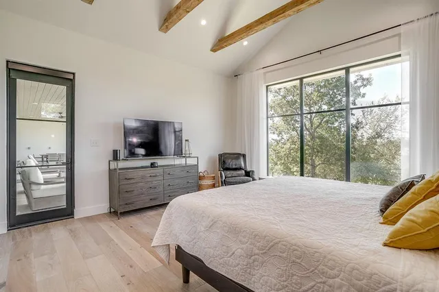 a bathroom with a bathtub sink and mirror
