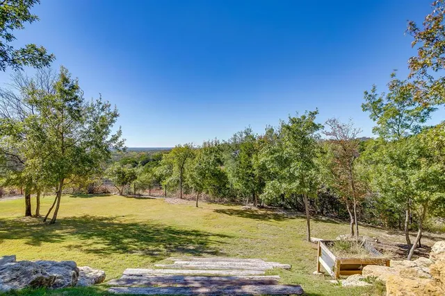 a view of a house with swimming pool and porch