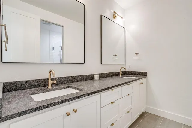 a bathroom with a bath tub with a shower