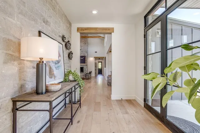 a living room with furniture fireplace and dining area