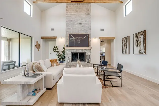 a kitchen with a sink cabinets and wooden floor