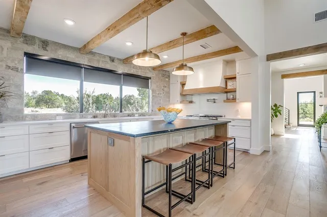 a kitchen with a table and chairs in it