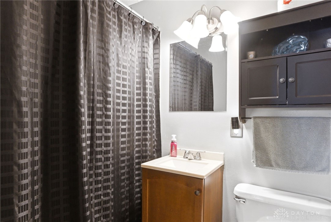 5171 Fishburg Road Dayton, OH 45424 - Photo 20 of 35 This bathroom features a sleek vanity and convenient overhead storage.