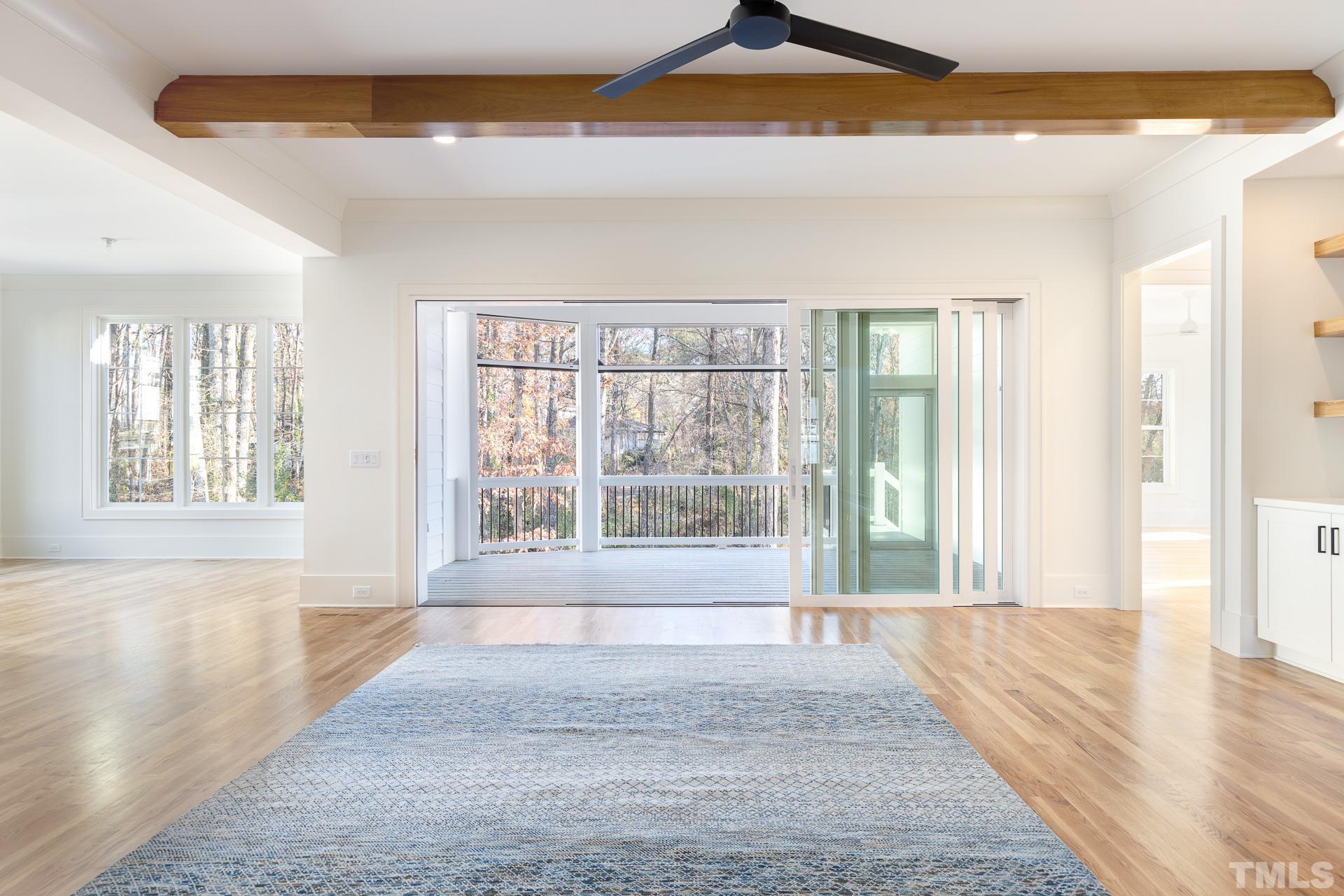 6312 Stephens Rdg Court Raleigh, NC 27615 - Photo 8 of 28 a view of an empty room with wooden floor and a window