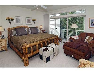 1180 North Frontage Road West, Unit 6A Vail, CO 81657 - Photo 5 of 12 a bed room with a bed window and a couch