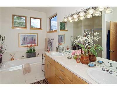 1180 North Frontage Road West, Unit 6A Vail, CO 81657 - Photo 6 of 12 a bathroom with a sink mirror and vanity