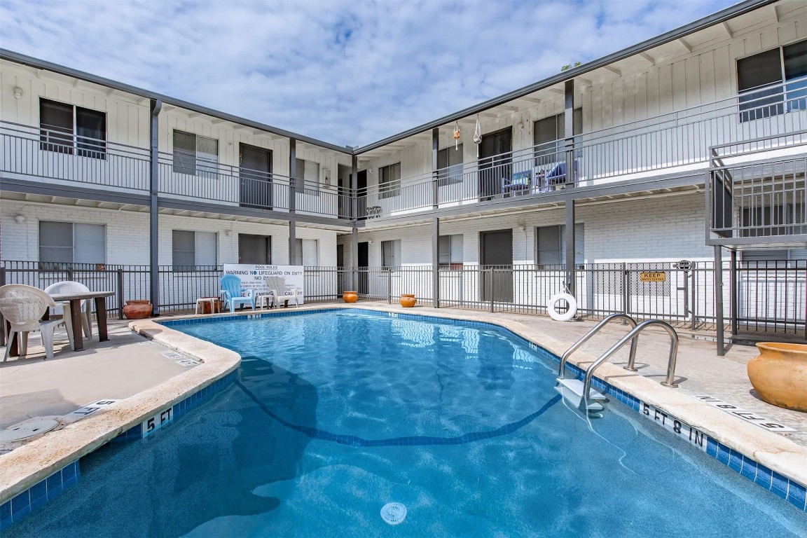 4206 Avenue A, Unit 211 Austin, TX 78751 - Photo 5 of 12 a view of a patio with swimming pool table and chairs
