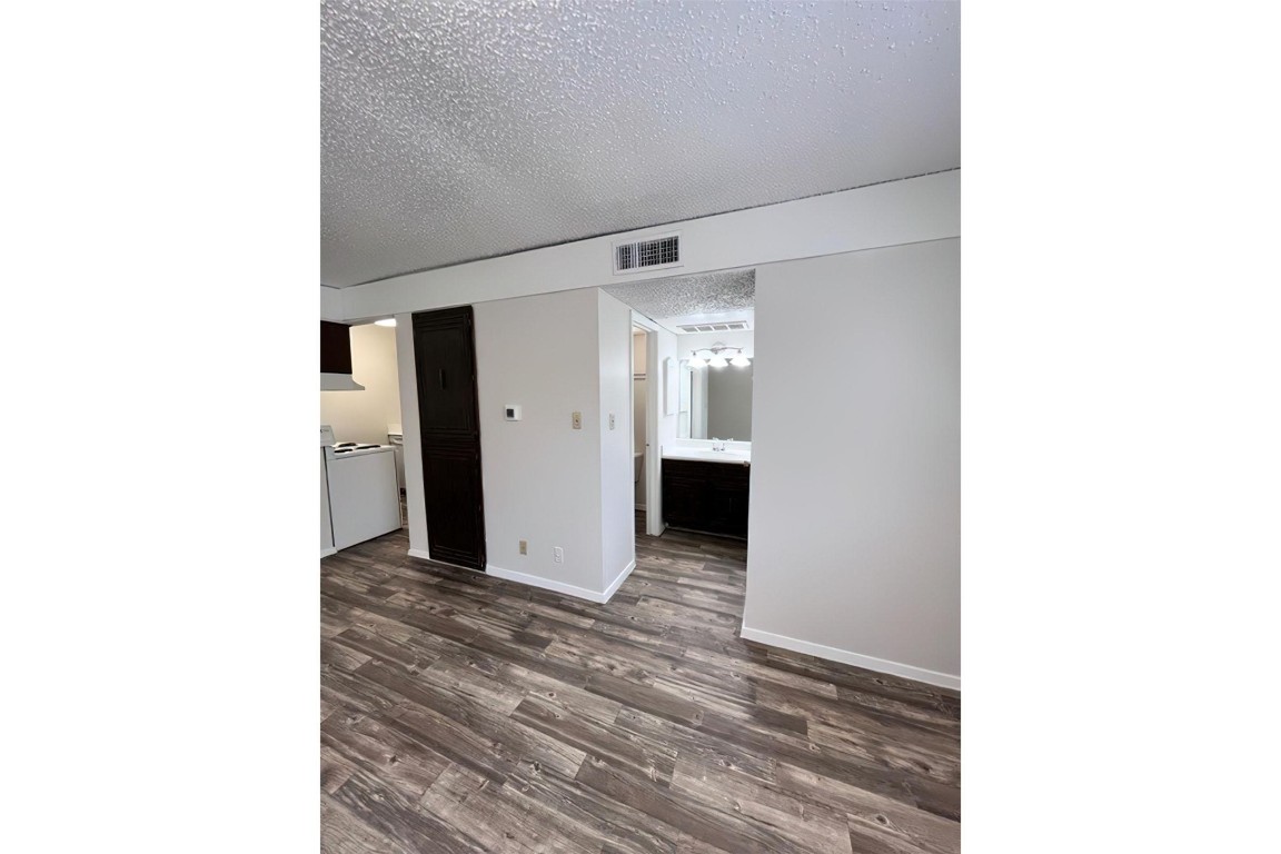 4206 Avenue A, Unit 211 Austin, TX 78751 - Photo 8 of 12 a view of a room with a hallway