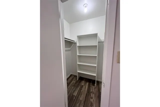 a view of a hallway with front door