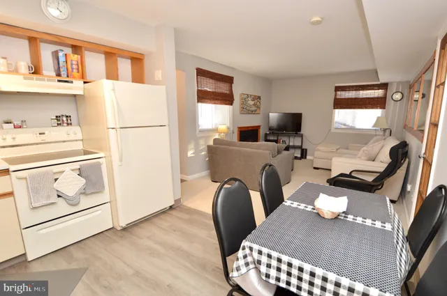 a workspace with furniture a washer and dryer