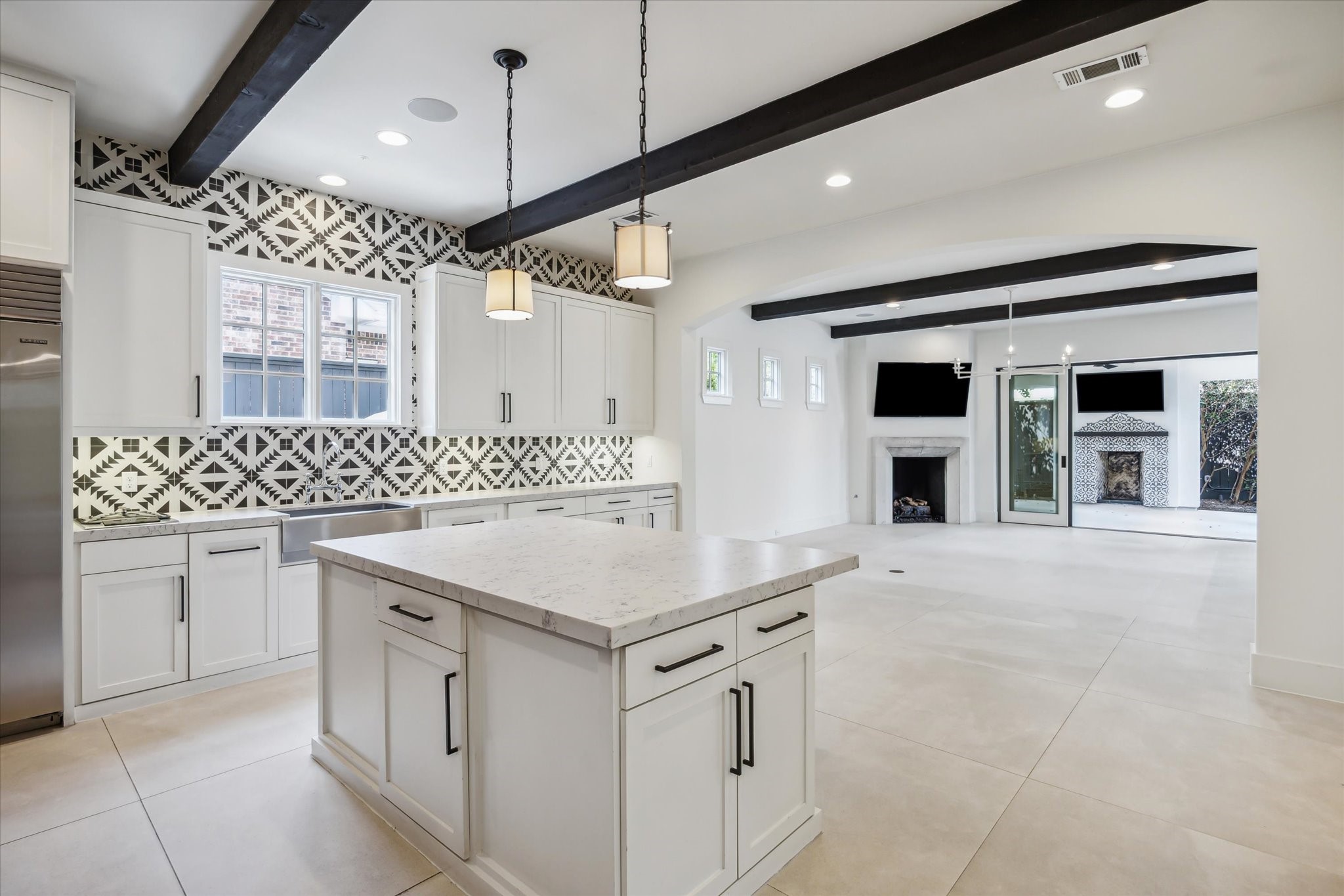 3214 Westheimer Road Houston, TX 77098 - Photo 15 of 39 The open-concept design flows effortlessly between the family room, breakfast room, and kitchen. This layout is ideal for entertaining while maintaining a sense of connection and warmth. It’s a true showcase of modern living.