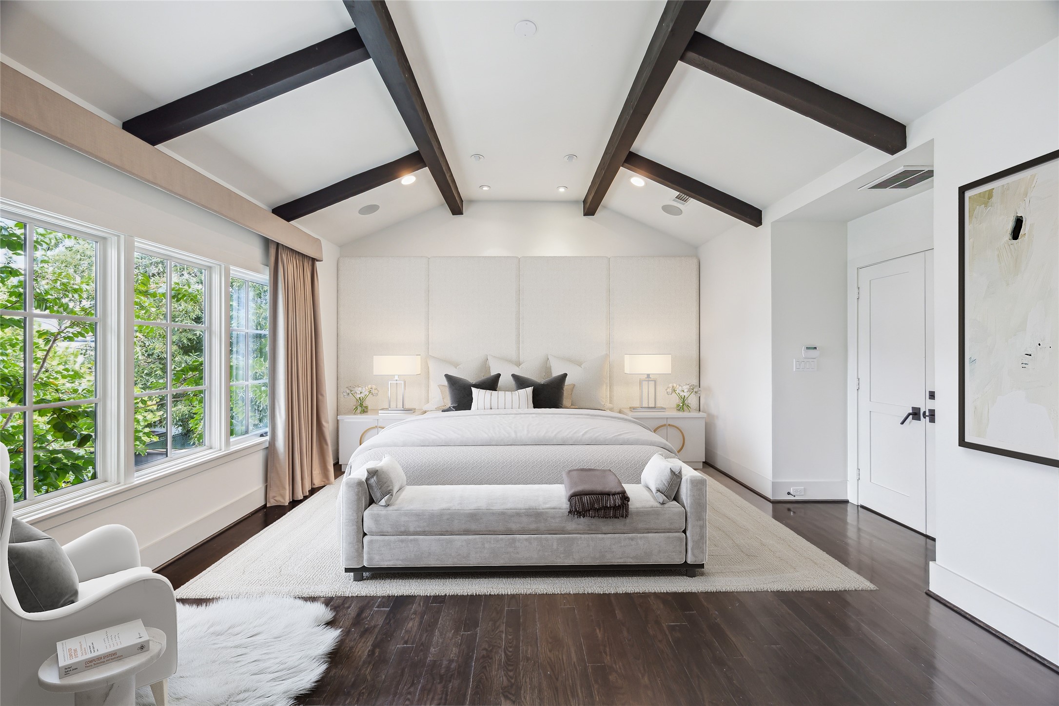 3214 Westheimer Road Houston, TX 77098 - Photo 21 of 39 The primary suite offers a serene retreat with vaulted ceilings, stained wood beams, and a wall of windows overlooking the pool and backyard. Motorized designer window coverings ensure both convenience and luxury.* Virtually rendered*