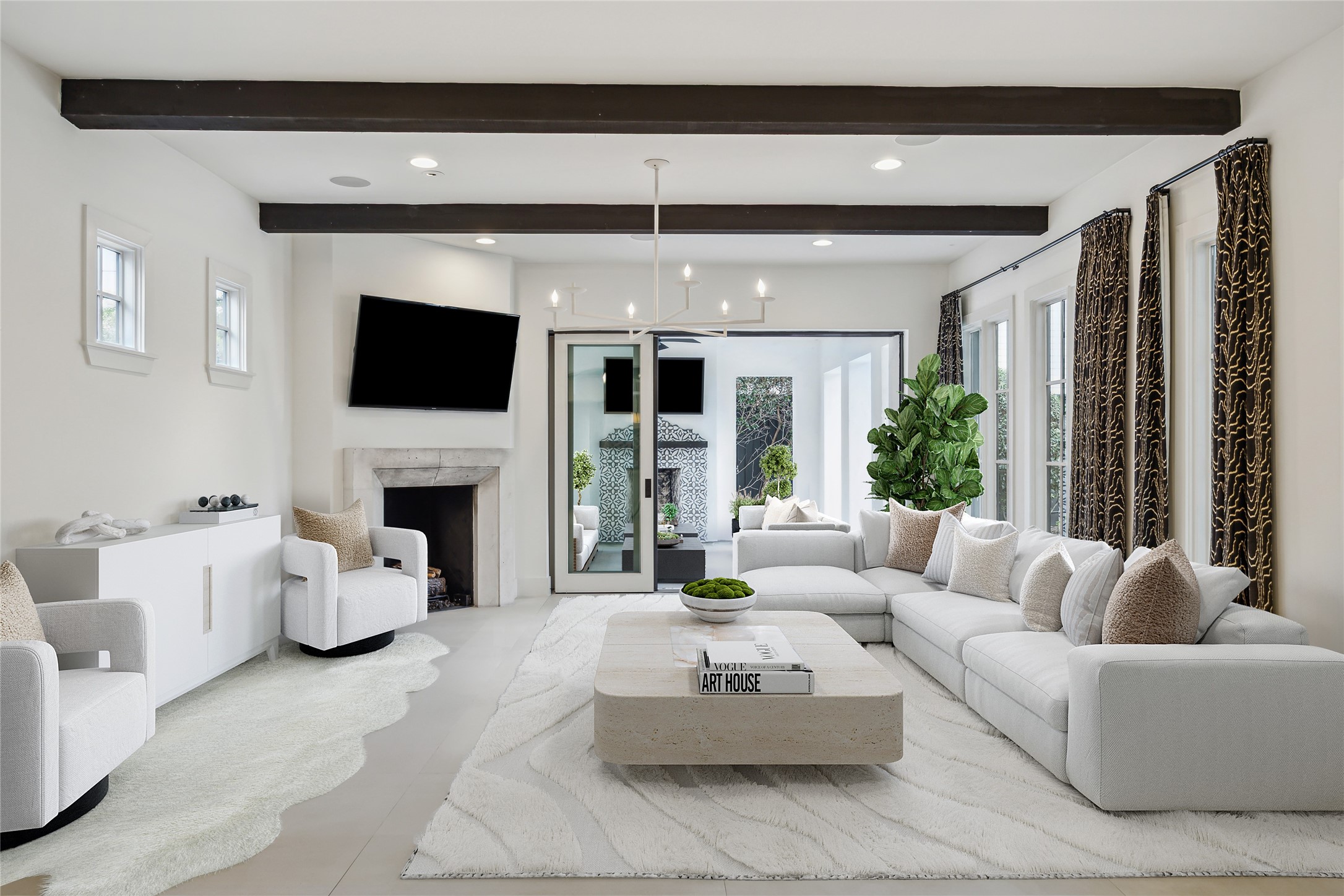 3214 Westheimer Road Houston, TX 77098 - Photo 9 of 39 Glass sliding stacking doors open the family room to the covered patio and pool, blending indoor and outdoor living effortlessly. This seamless transition creates a perfect setting for both relaxing and entertaining. *Virtually rendered*