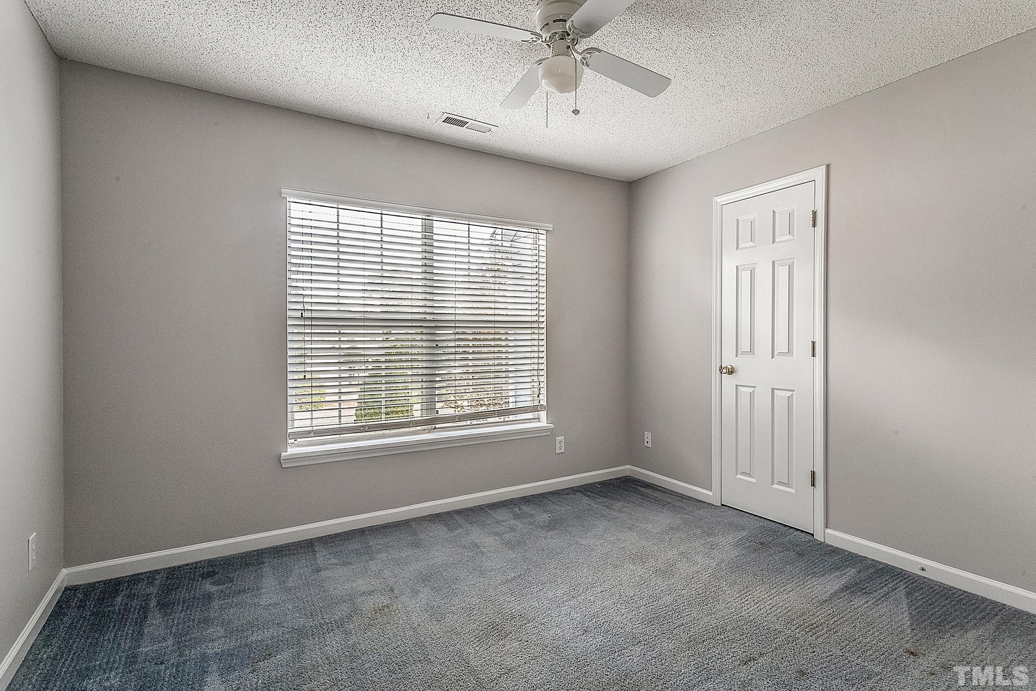 121 Marleton Way Holly Springs, NC 27540 - Photo 12 of 26 a view of an empty room with a window