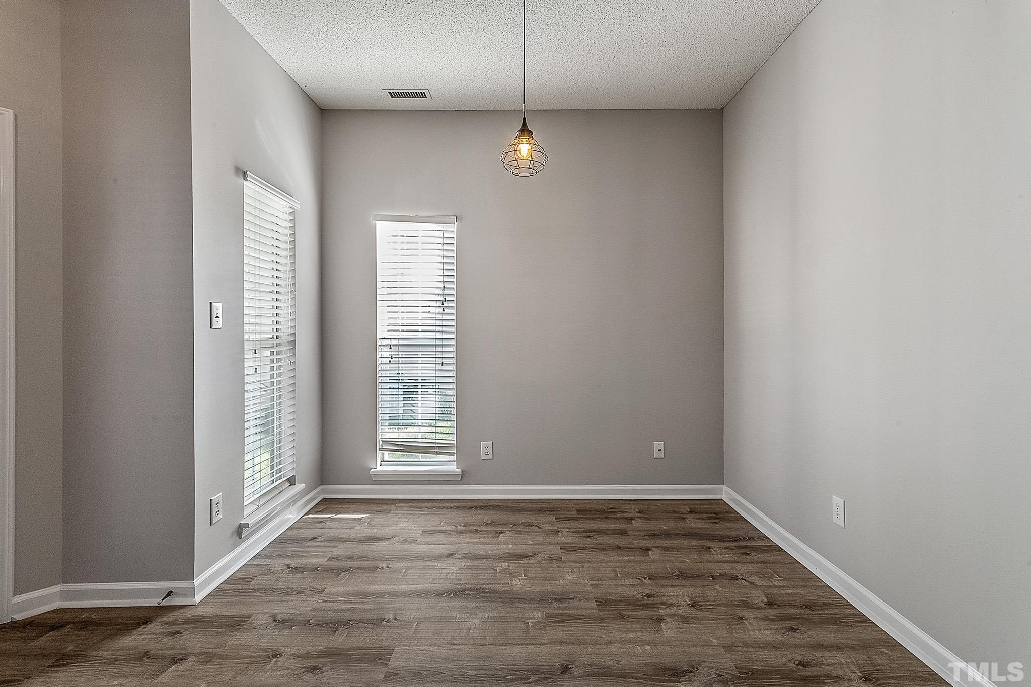 121 Marleton Way Holly Springs, NC 27540 - Photo 13 of 26 a view of an empty room with a window