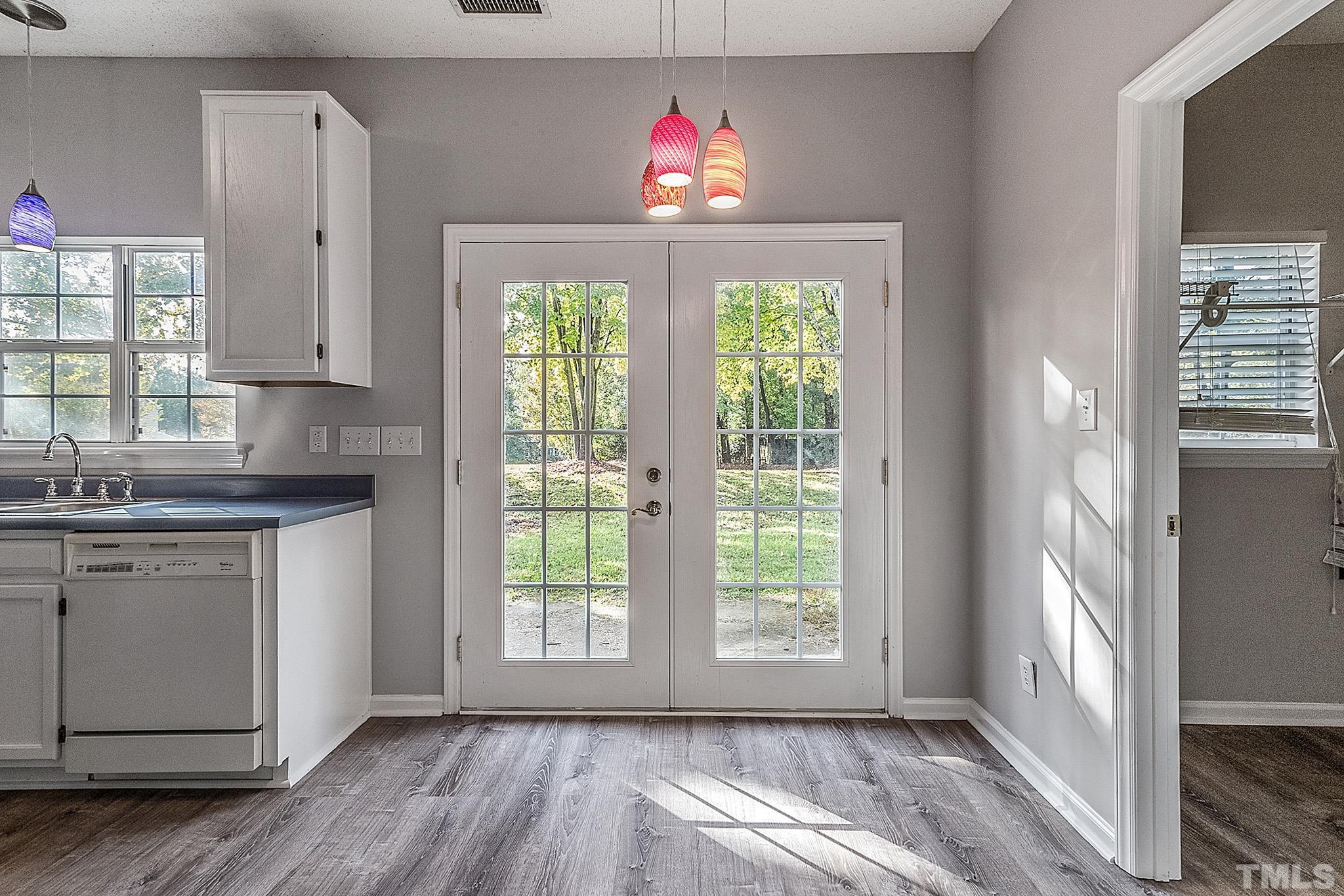 121 Marleton Way Holly Springs, NC 27540 - Photo 14 of 26 a kitchen with granite countertop a stove and a window