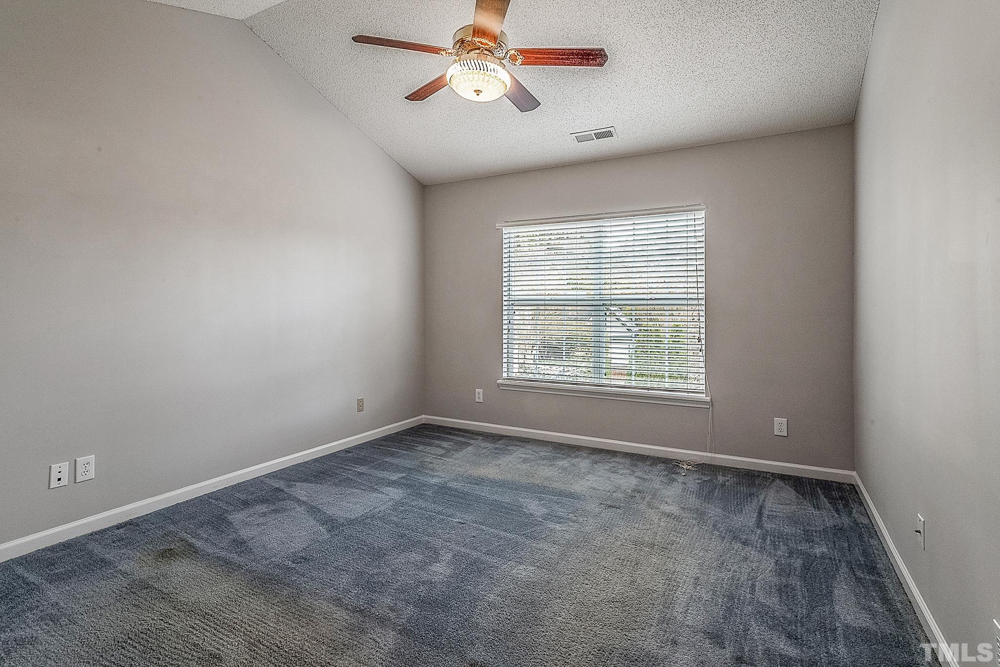 121 Marleton Way Holly Springs, NC 27540 - Photo 22 of 26 a view of an empty room with a window