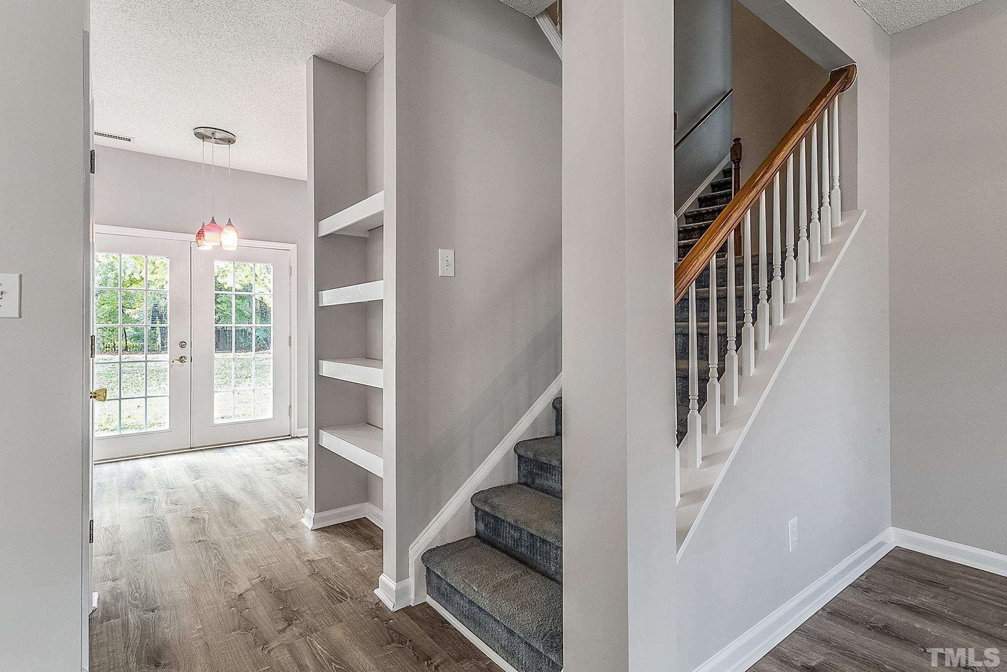 121 Marleton Way Holly Springs, NC 27540 - Photo 10 of 26 a view of entryway with wooden floor and stairs