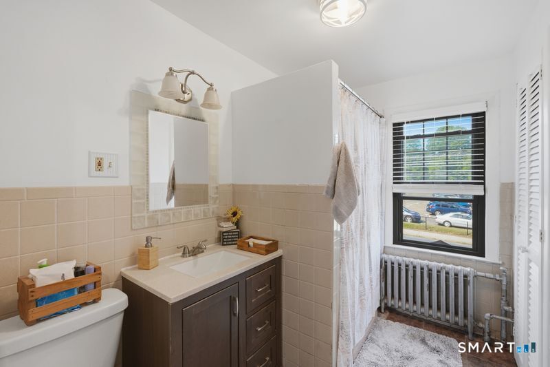 443 Highland Avenue Waterbury, CT 06708 - Photo 18 of 24 a bathroom with a sink and a mirror