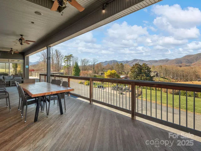a view of a chairs and table in patio