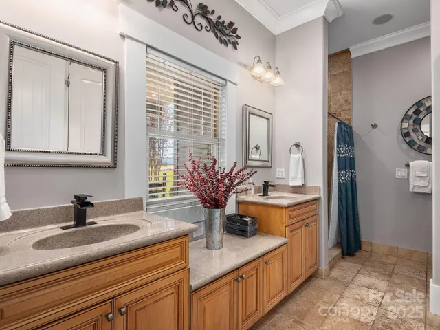 a kitchen with stainless steel appliances kitchen island granite countertop a sink and cabinets