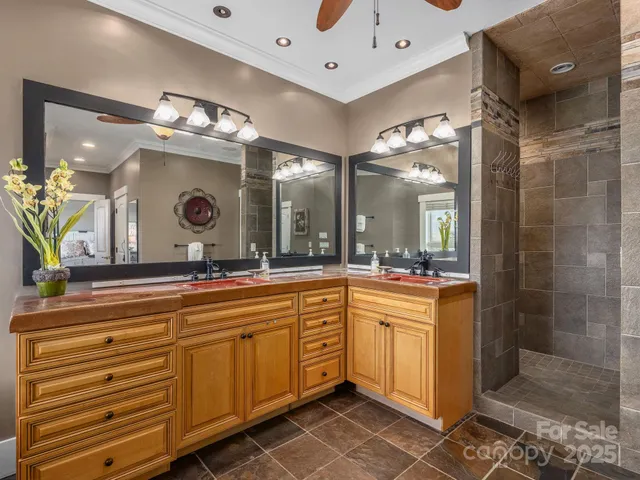 a large bathroom with a sink mirror and a shower