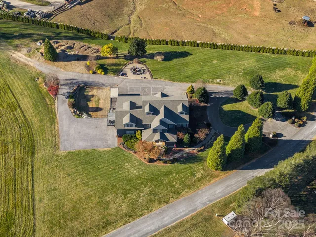 a view of a lake with lawn chairs