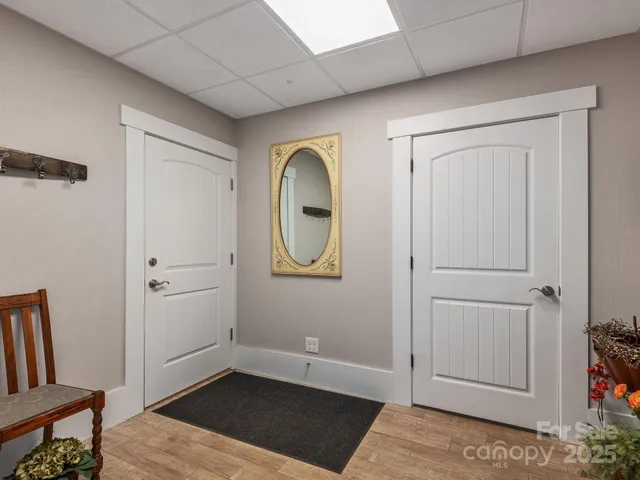 a view of an entryway with wooden floor