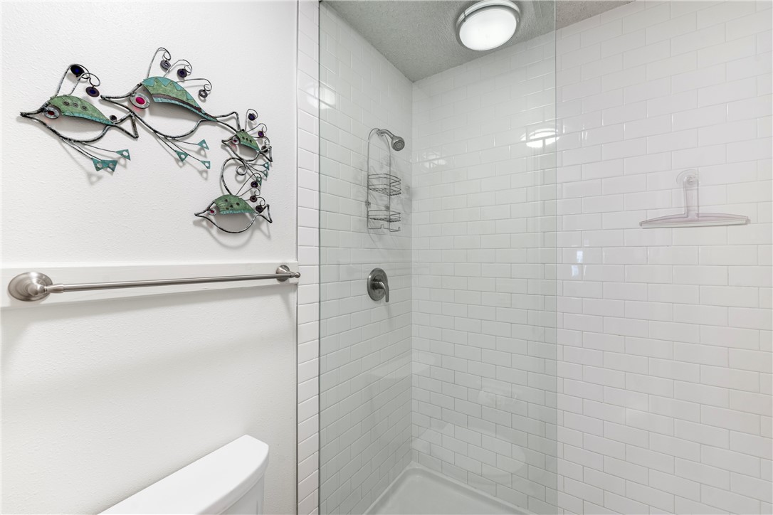 622 Beach Access Road, Unit 229 Port Aransas, TX 78373 - Photo 12 of 24 a bathroom with a shower