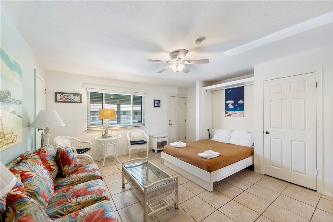 622 Beach Access Road, Unit 229 Port Aransas, TX 78373 - Photo 4 of 24 a living room with furniture and wooden floor