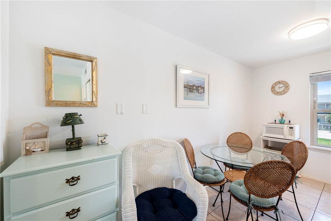 622 Beach Access Road, Unit 229 Port Aransas, TX 78373 - Photo 9 of 24 a view of a workspace with furniture and wooden floor